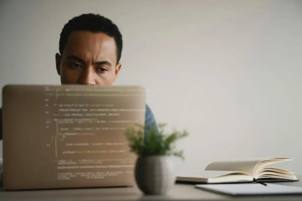 Person working on a laptop with data analytics visible on the screen